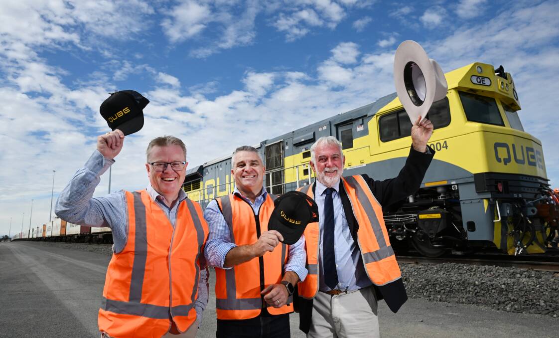 Tamworth Regional Council General Manager Paul Bennett, Qube Logistics Sean Hovey and mayor Russell Webb tip their hats to the milestone step in the Intermodal Freight line project. Picture by Gareth Gardner