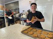 Rebecca Walker with a tray of freshly baked Anzac biscuits. Picture by Heath Forsyth 