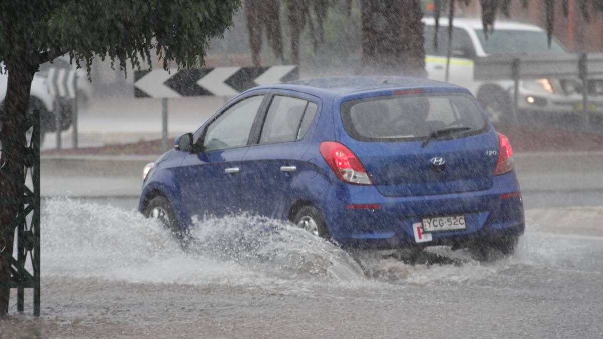 Heavy rain: A motorist navigates through the deluge of water.