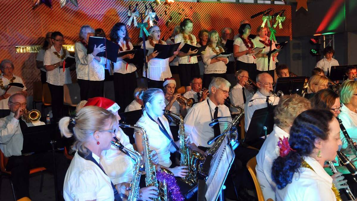 Great night: Carollers and musicians join forces to bring a night of carols to Tamworth. Carols by Candlelight will be held on December 16. Photo: Geoff O'Neill