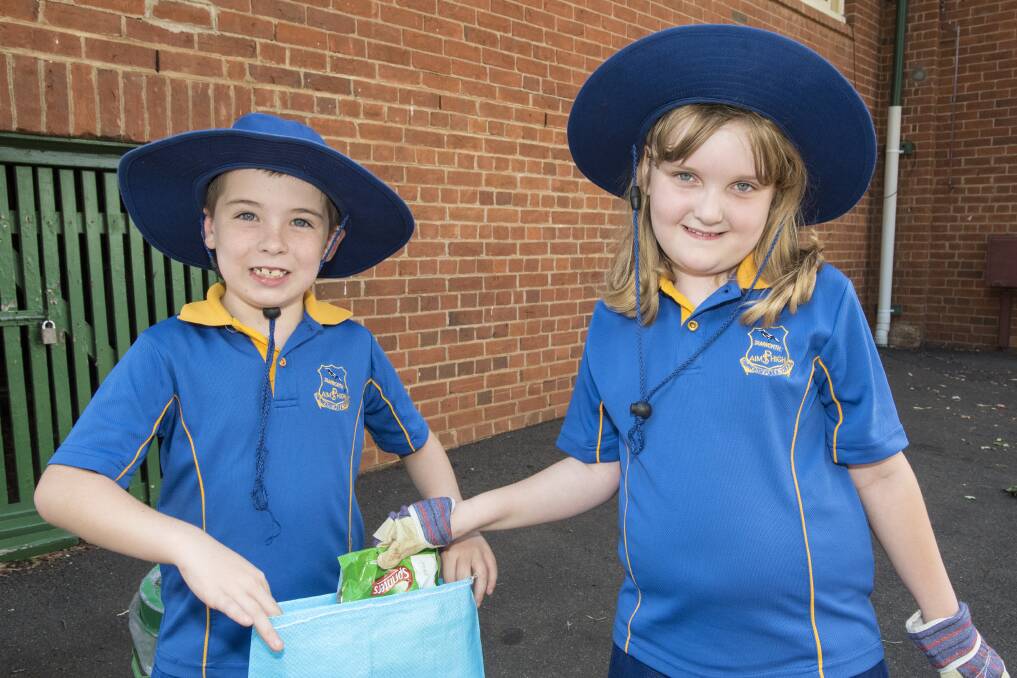 All smiles: Tamworth Public School students Jay Malley and Kiara Delaney pulled on the gloves on Friday. Photo: Peter Hardin 030317POHD045