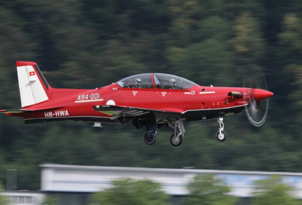 OFF THE GROUND: The Pilatus PC-21 aircraft taking its first initial production test flight at their factory in Stans, Switzerland. Photo: PRNewsFoto/Lockheed Martin