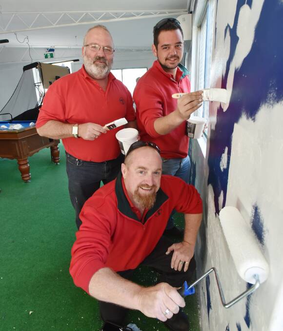 NEW LOOK: (Back) James Durrant, Adam Carr, (Front) Glenn Dewhurst give the PCYC a fresh coat of paint. Photo: Geoff O'Neill 12-08-16