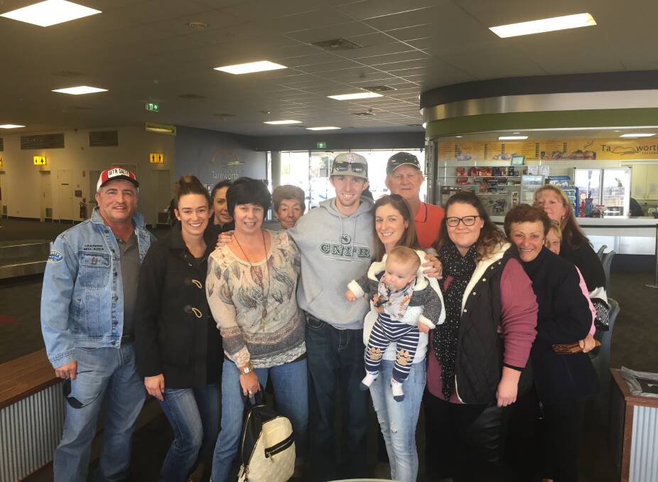 Welcome home: Surrounded by family and friends Hallsville bull rider Brady Gray arrives back in Tamworth on Friday.