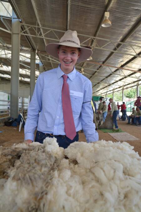 Students had a go at junior merino sheep and fleece judging as part of the Northern Merino Ram Breeders’ Association Armidale Ram Show and Sale yesterday. Photos: Stephanie van Eyk