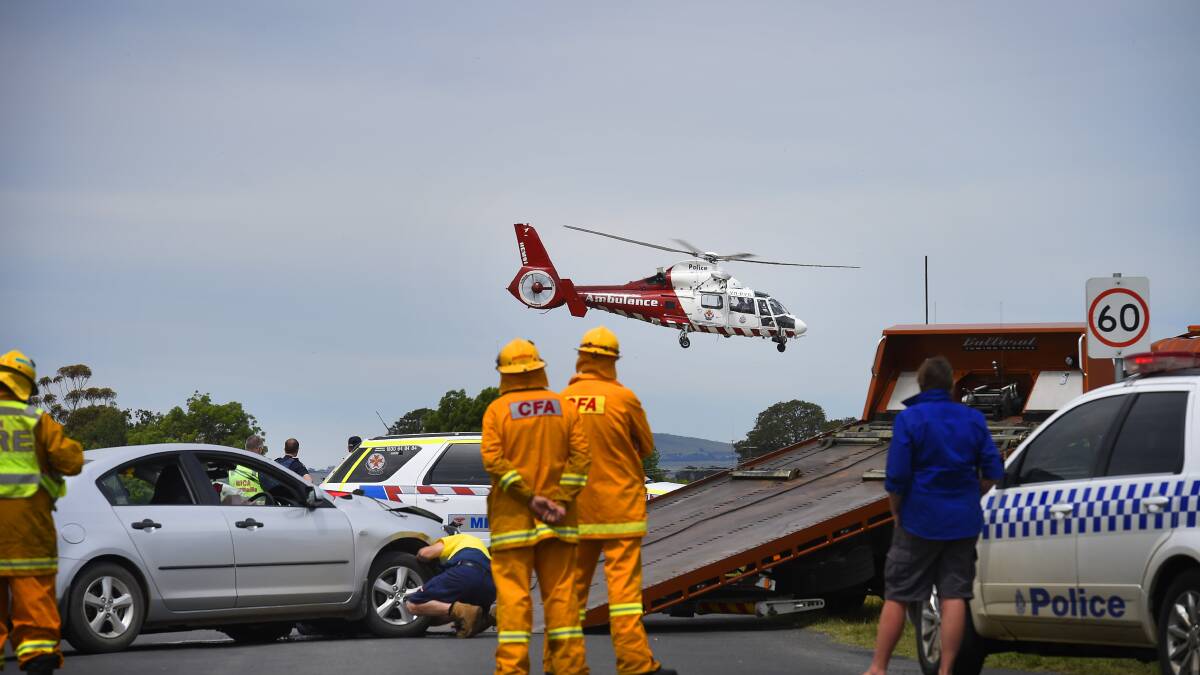 AIRLIFT: The air ambulance arrived at the scene shortly after the accident transporting one man to Melbourne in a serious but stable condition. Picture Luka Kauzlaric.
