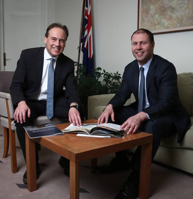 NEW JOB: Josh Frydenberg (right) takes over the environment portfolio from Greg Hunt (left), but his former role as Resources Minister has some questioning his agenda.