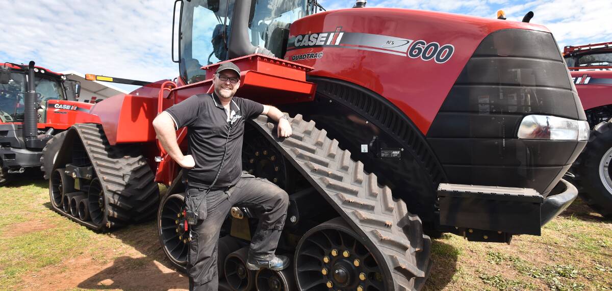 BIG RED: Rural Event's Aaron Harley, with a Case IH tractor. Manufactures expect interest in broad acre equipment. Photo: Geoff O'Neil 100816GOB04
