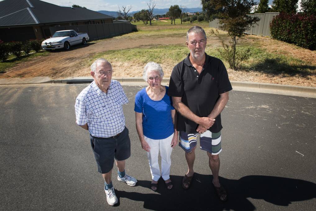 WRONG PLACE: The Peak residents John and Ann Crosby, and Greg Burnes say the access road is going to be a problem. Photo: Peter Hardin