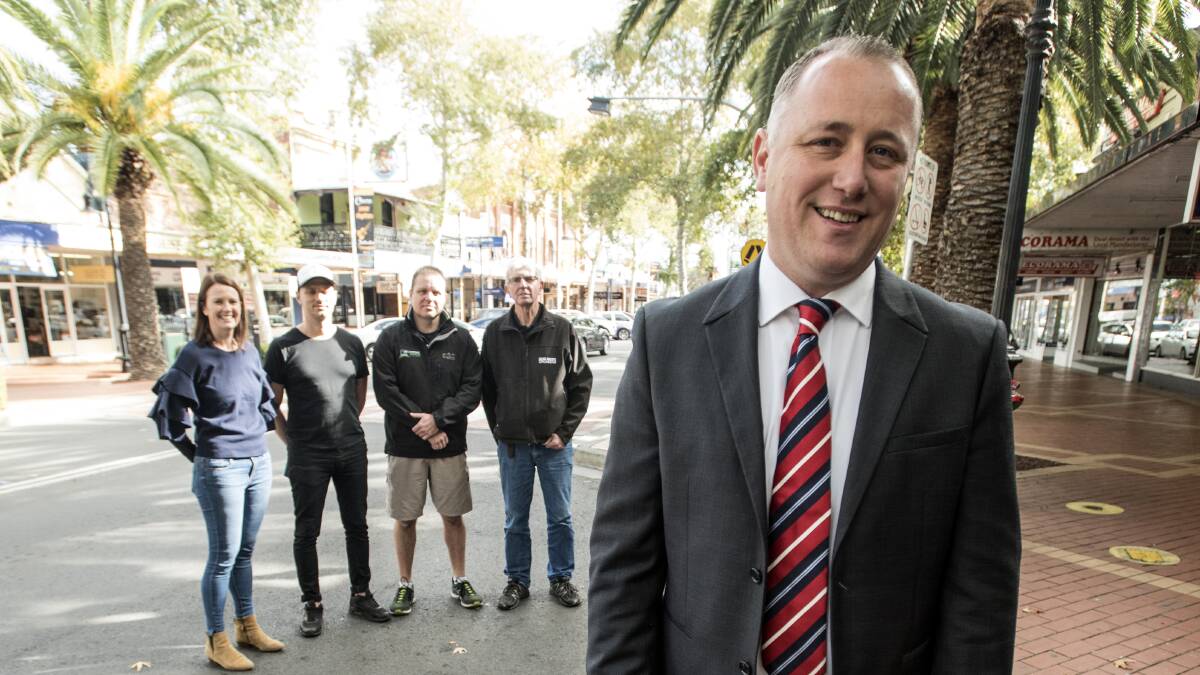 CHEERING: Business Chamber president Jye Segboer and Peel street operators Jill Stewart, Adrian Coffey, Roger Cupples and Norm Hindmarsh have put their hands up to take over the management of the street during festival.