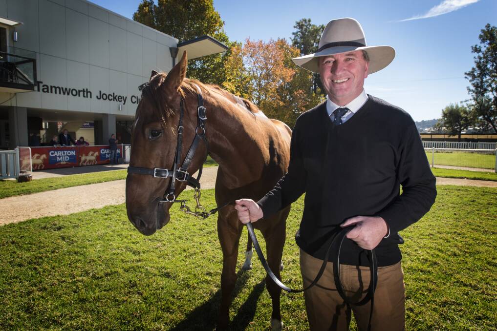 TAKING THE REINS: New England MP and Agriculture Minister Barnaby Joyce with one of the region's local products. Photo: Peter Hardin 170517PHC010