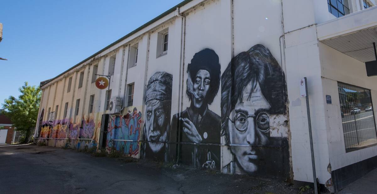 WALL OF ART: John Lennon, Jimmy Hendrix and Willie Nelson. The wall was also used by local graffiti groups to hone their skills. Photo: Peter Hardin 280916PHA010