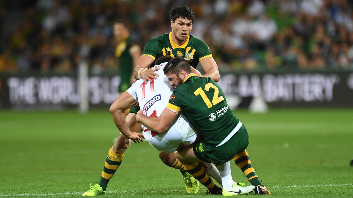 England's Sam Burgess and Australia's Matt Gillett and Jordan McLean contest as Burgess injures sustains an injury. Picture: AAP Image/ Julian Smith