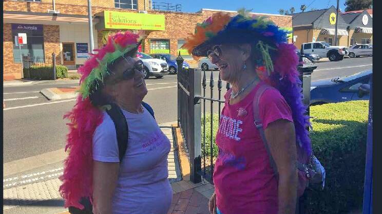 COLOURFUL BIRDS: Eileen Edwards and Samantha Van Zonneveld of Hervey Bay get into town early on Saturday morning to beat the heat. Photo: GENEVIEVE SMITH.