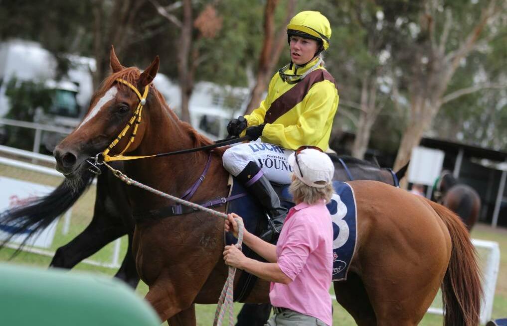 Ready to race: Sally Torrens, pictured, talking to jockey, Sally Young. Photo: Namoi Valley Independent