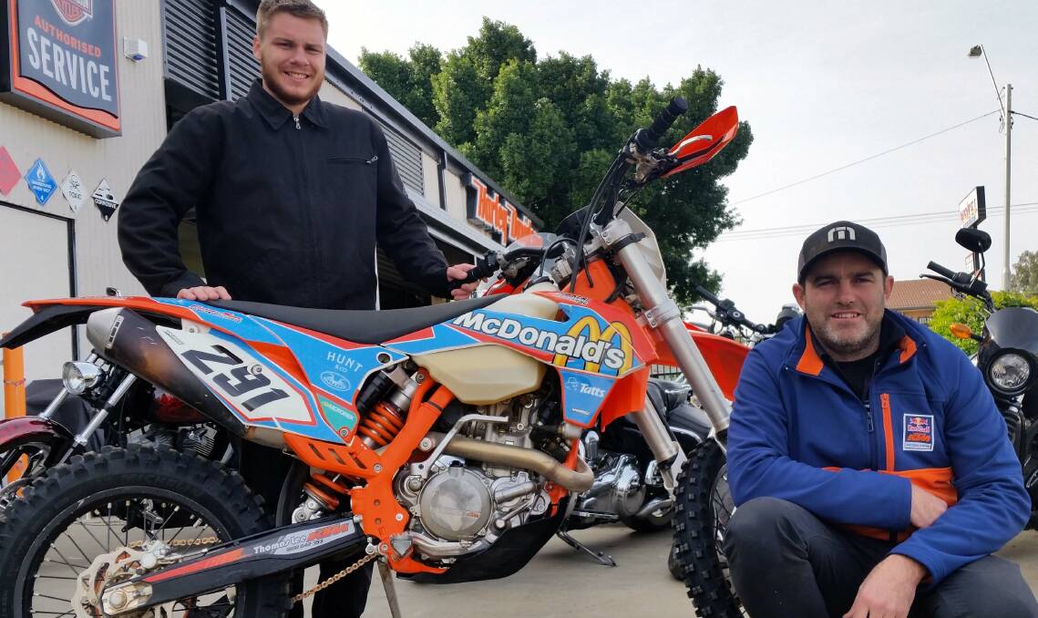 Job done: Jesse Moore (standing) and Scott Madden competed against the best on offer at the recent Tatts Finke desert race in the Northern Territory. Moore rode a KTM 450 SX-F while Madden was aboard a KTM 500 EXC. 