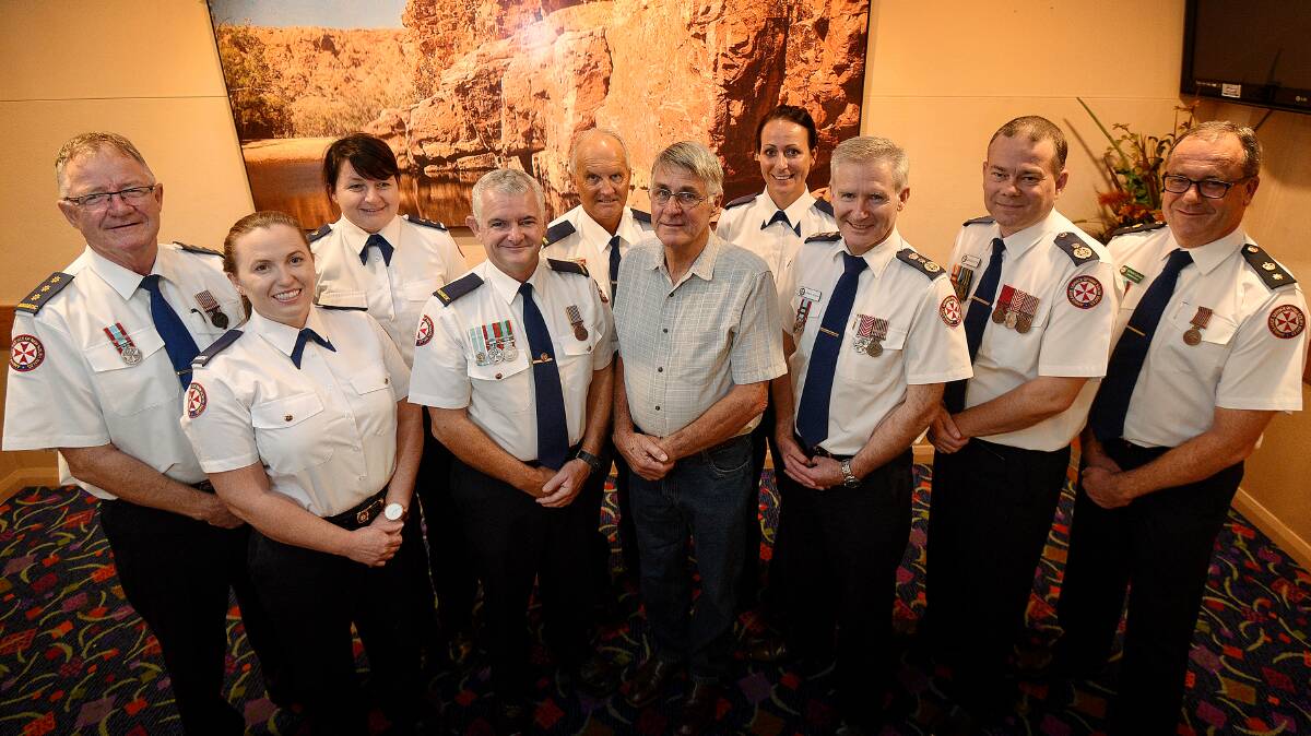 Service with a smile: The paramedics pose after the ceremony to recognise 189 years of combined service to Ambulance NSW. Photo: Gareth Gardner 150217GGE03