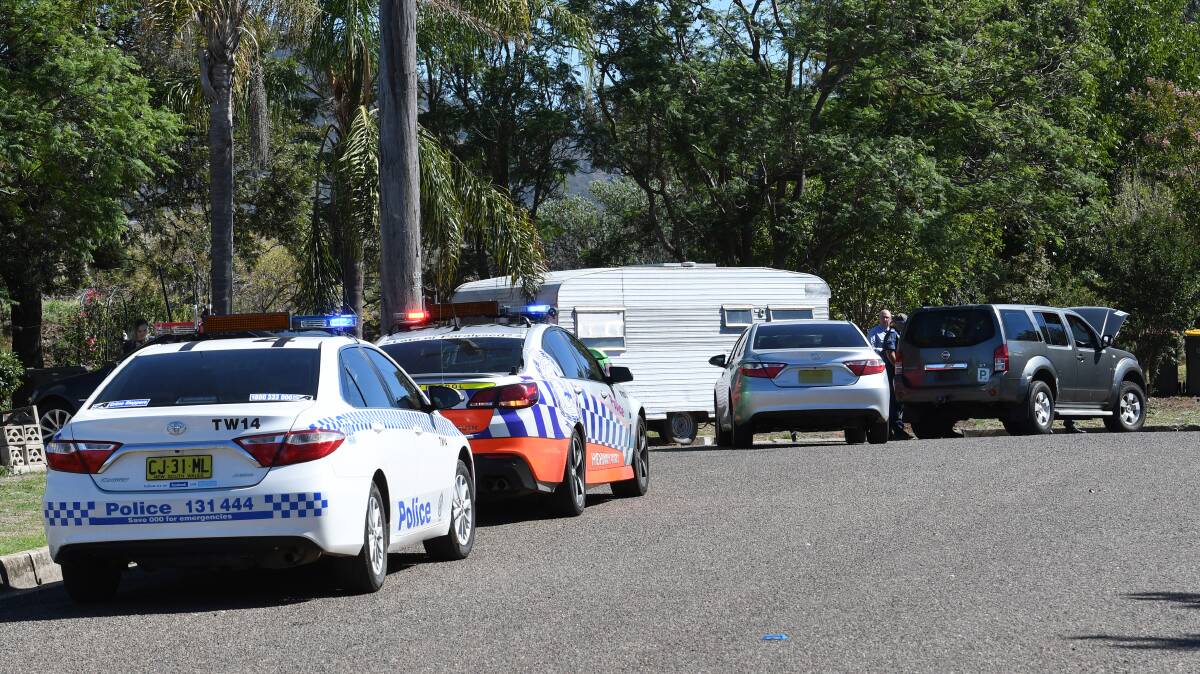 Police at the scene of the arrest in Somerset Place, Nemingha, off Armidale Road. Photos: Gareth Gardner