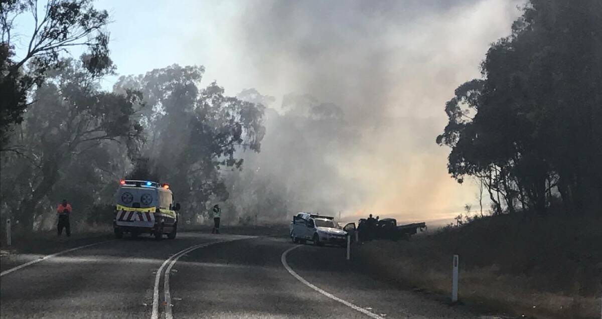Fiery crash: The scene of the fatal crash between a truck, a stolen ute and a police car on the New England Highway, between Bendemeer and Uralla. Photo: Damo Marsh