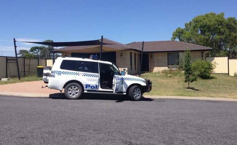 Crime scene: Police cordoned off the home in Mackenzie Court while specialist officers were called in from Sydney. Photo: Fire and Rescue NSW