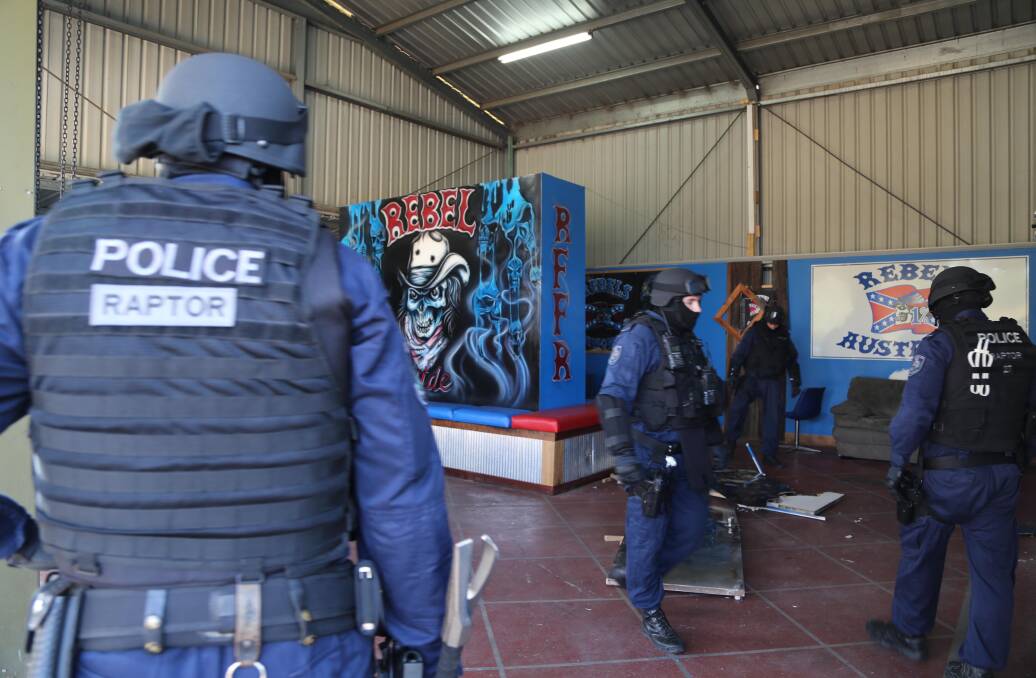 Rebels bust: Strike Force Raptor - the state's gangs squad - and Tamworth police dismantle the OMCG's clubhouse in East Tamworth on March 10, 2015. Photo: NSW Police 