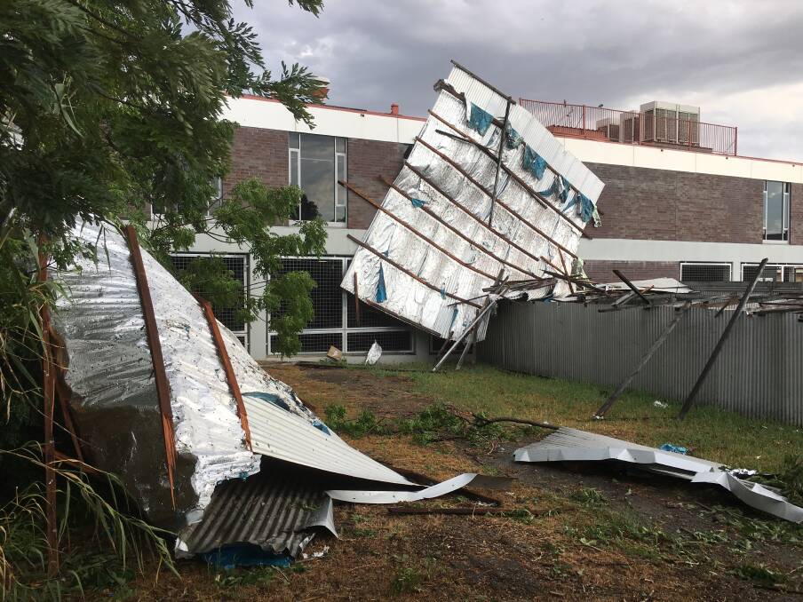 DAMAGE: Roof off a Bourke St building in Tamworth. Photo: Bryan Singh