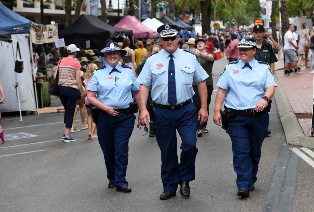 Crowds well-behaved: Oxley Acting Superintendent Jeff Budd, pictured middle, talking with Detective Chief Inspector Denise Godden and Inspector Kylie Endemi, right, during the 2017 festival. Photo: Gareth Gardner