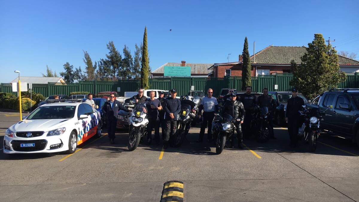 Ready to ride: The Oxley police and highway patrol officers from Tamworth make a quick pit-stop before leaving town for the Wall to Wall ride.