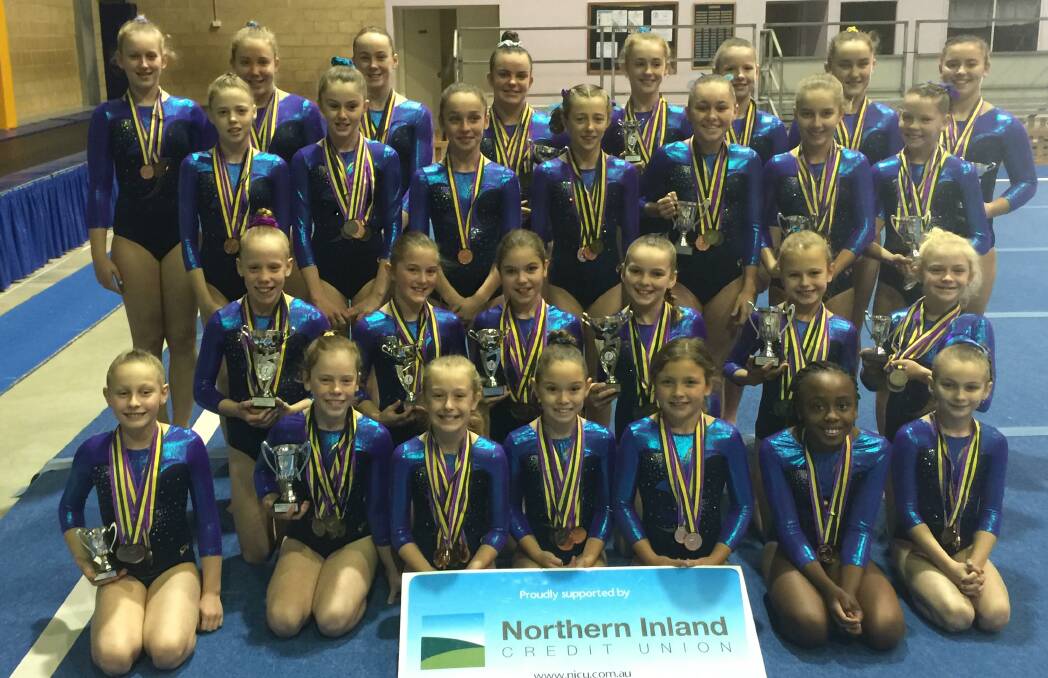 Golden girls: Tamworth Gymnastics Club members with their medals and trophies won at the Country Capital Cup. (Front from left) Sophie Weekes, Tori Monaghan, Lily Godley, Jessica Litchfield, Sidney Turner, Isabel Zifodya, Saphire Kuczer (second row from left) Maisie Wilde, Georgia Goodwin, Annalise Tighe, Amber Downes, Chloe Bateup, Piper Swalwell (third row from left) Kelsey Dietrich, Emma Byrne, Marni Evans, Paige Seaton, Jorja McCluand, Erin Allan, Aaliyah Morley (back from left) Hannah Dowden, Ellie Hannaford, Abby McGrath, Julia Hannaford, Josie Douglas, Skyler Dowden, Jemma Baker, Lexi May.