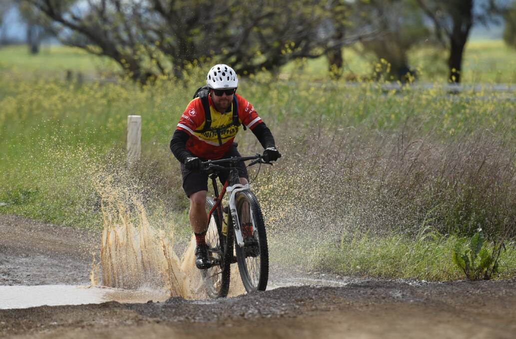 Will Lulham from Tamworth didn't mind getting dirty on the last leg of the ride. Photo: Gareth Gardner