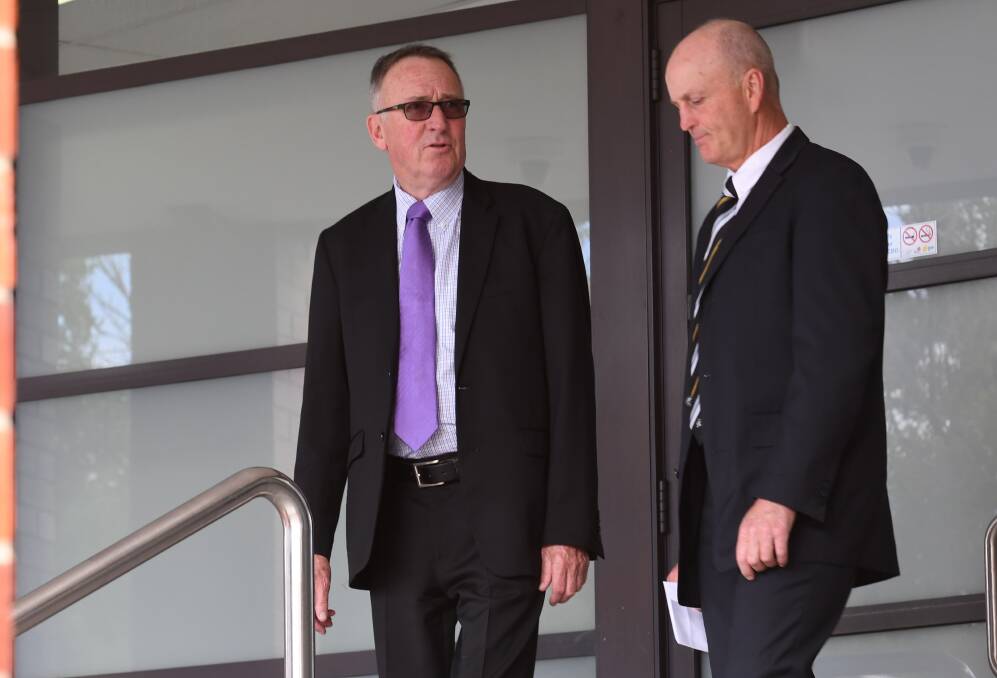 Guilty verdict: Crown prosecutor Bryan Rowe, left, and one of the officers-in-charge of the murder investigation, Detective Senior Constable Graham Goodwin outside Tamworth court on Monday. Photo: Gareth Gardner