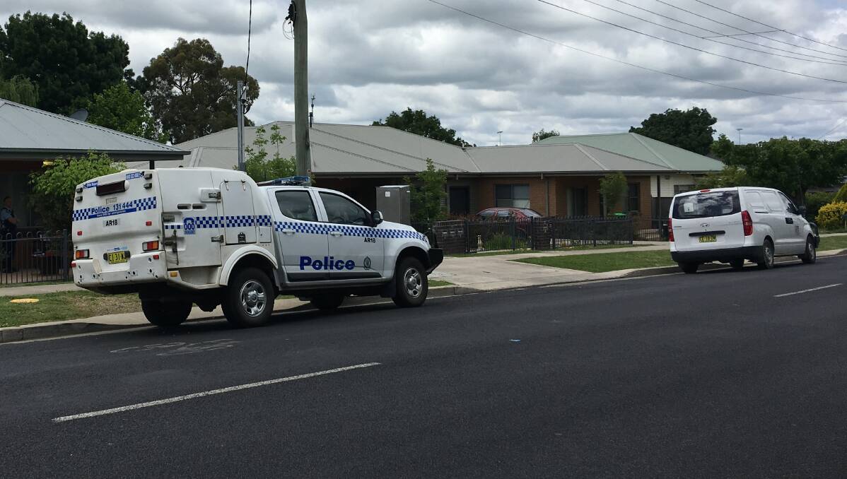 Crime scene: Police and forensic officers at the Taylor St unit in Armidale on Tuesday morning. Photo: Matt Bedford