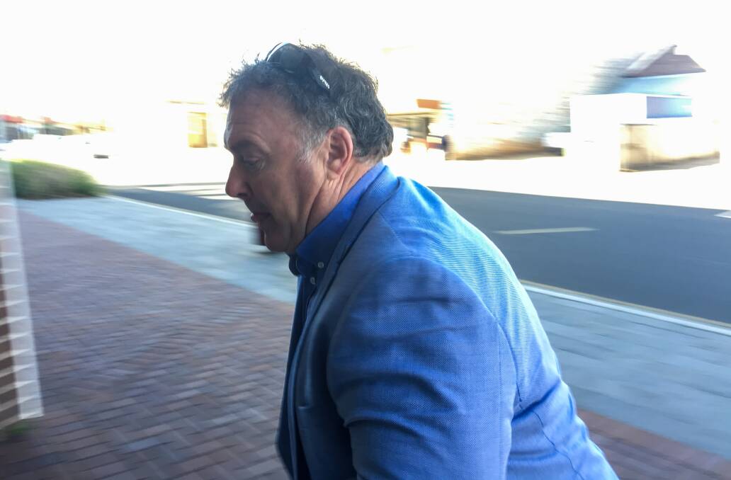 Legal challenge: Rod Culleton tries to avoid Fairfax Media outside Armidale Local Court on Monday morning. Photo: Matt Bedford