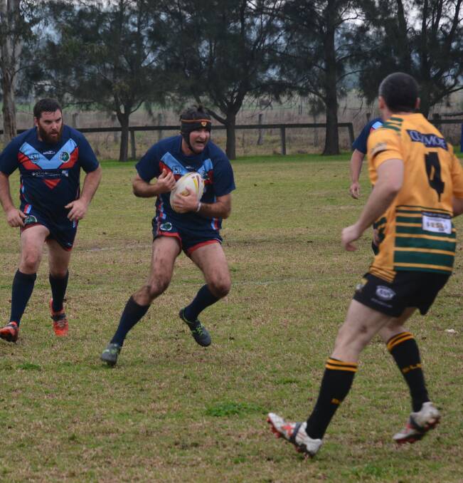 Charging in: Oxley's Rob Wilson charges in during the wet game against Hunter Valley Broncos on Wednesday afternoon in Scone. The Broncos won 10-6. Photos: Ben Murphy