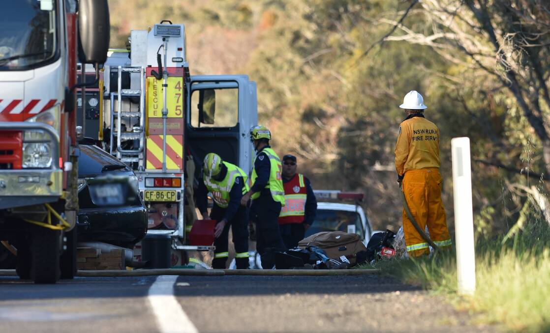 Horrific scene: Emergency services at the scene of the double fatal crash which shut the New England Highway between Uralla and Bendemeer for several hours. Detectives are trying to determine the cause. Photos: Gareth Gardner 