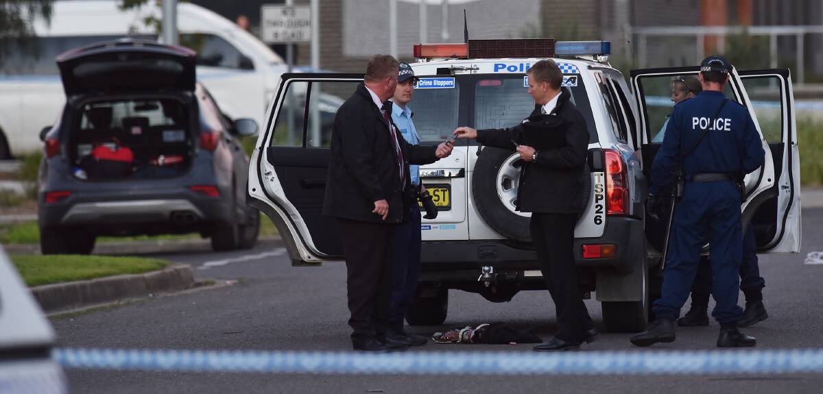 IN CUSTODY: Investigators surround the scene were a man was detained for questioning over an alleged stabbing attack in Coledale. Photos: Gareth Gardner 
