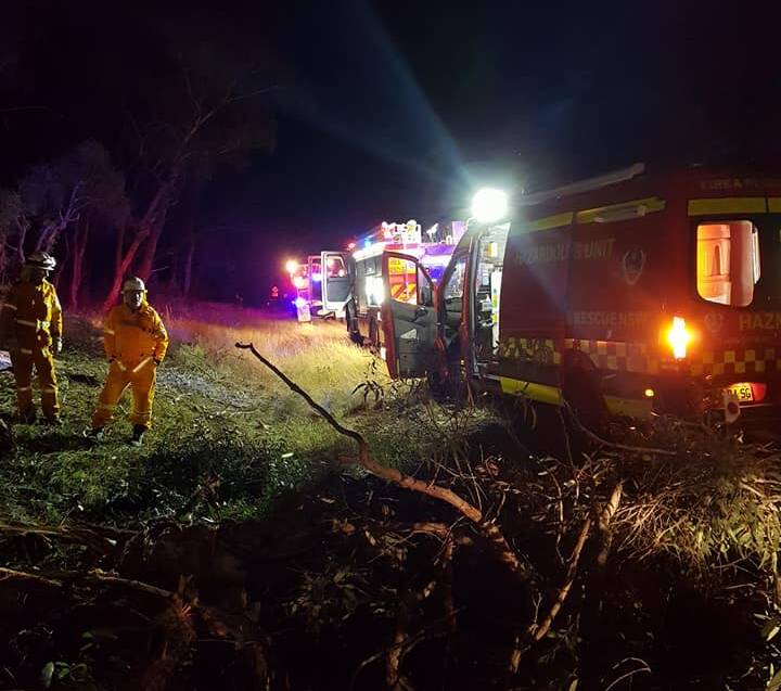 Truck rollover: The scene of the crash on the New England Highway near Bendemeer on Monday night. Photo: Fire and Rescue NSW