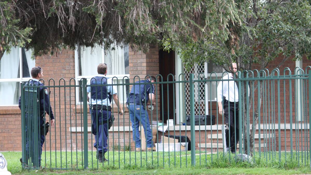 Stretched resources: Oxley detectives at the scene of a search warrant on a Gunnedah home as part of Strike Force Burrill - a massive drug and guns investigation that saw 38 guns and drugs seized.