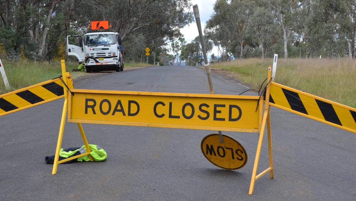 Crime scene: Council workers closed Elsmore Rd while police examined the crash scene. Photo: Laurie Bullock