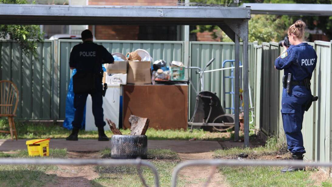 Crime scene: Forensic officers comb the backyard of a Little Barber St property where the explosion occurred on November 6. Photo: Sam Woods