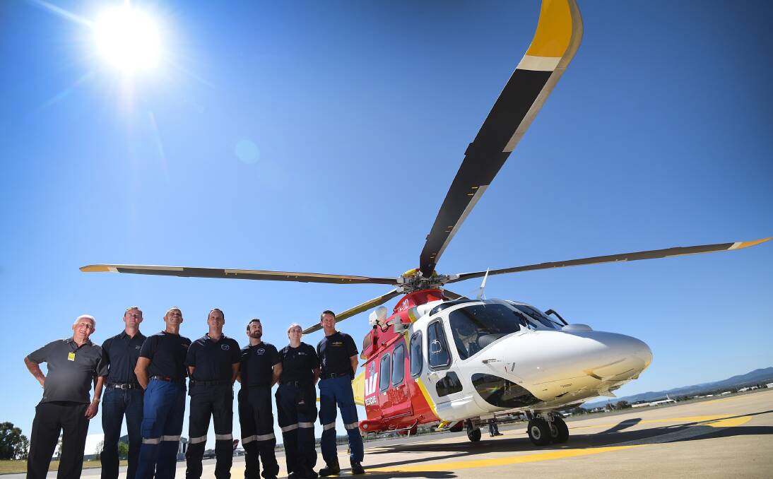 All smiles: From left, Max Cathcart, Matthew Wallace, Paul Johnson, Sean Maher, Dylan Cross, Jodie Reardon and Shane Harris with the new Westpac Rescue Helicopter in Tamworth. Photo: Gareth Gardner 