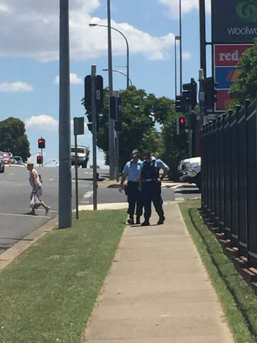 Crime scene: Tamworth police at the scene of a suspected shot fired into a Bridge St business. Photos: Breanna Chillingworth 