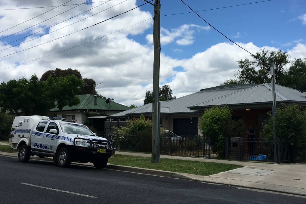 Crime scene: Police at the Taylor St unit in Armidale on Tuesday morning. Photo: Matt Bedford