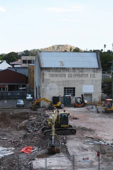 Going down: Demolition crews knocked down the last of the remaining walls of the old BWS bottle shop on Brisbane St to make way for the expansion to the CH on Peel hotel. Photo: Gareth Gardner 120217GGE03