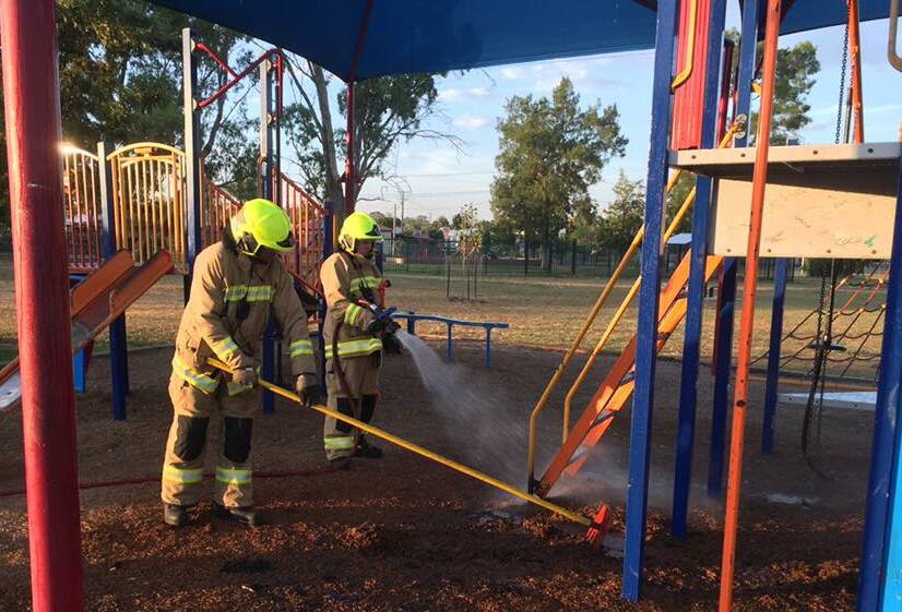 Deliberate fire: Fire and Rescue NSW crews from the West Tamworth brigade extinguish the blaze at Hyman Park on Sunday. Photo: West Tamworth 508 Fire & Rescue NSW