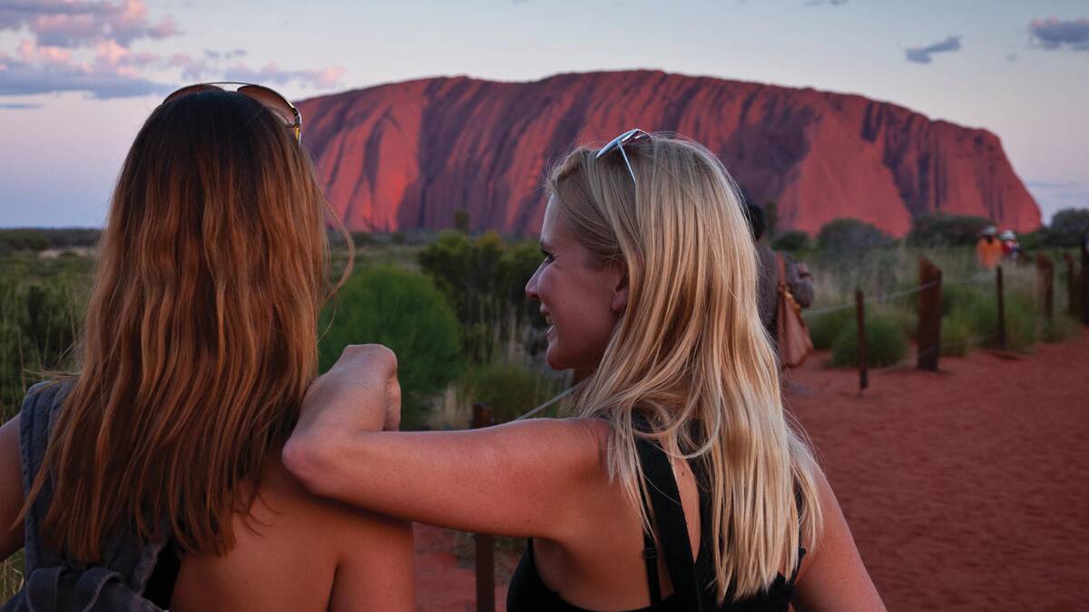 Uluru … Intrepid’s itinerary includes a guided walk around its base. 