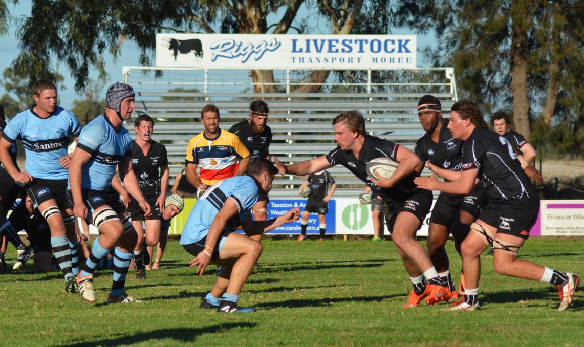 RUGBY RIVALS: Moree's Cameron Ledingham charges into the Narrabri defence during their round win over the Blue Boars in May. The two will clash on Saturday in the first elimination final. Photo: Sophie Harris