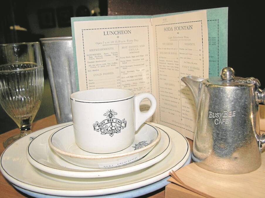 Crockery, a jug and a 1983 menu from the Busy Bee Cafe.
