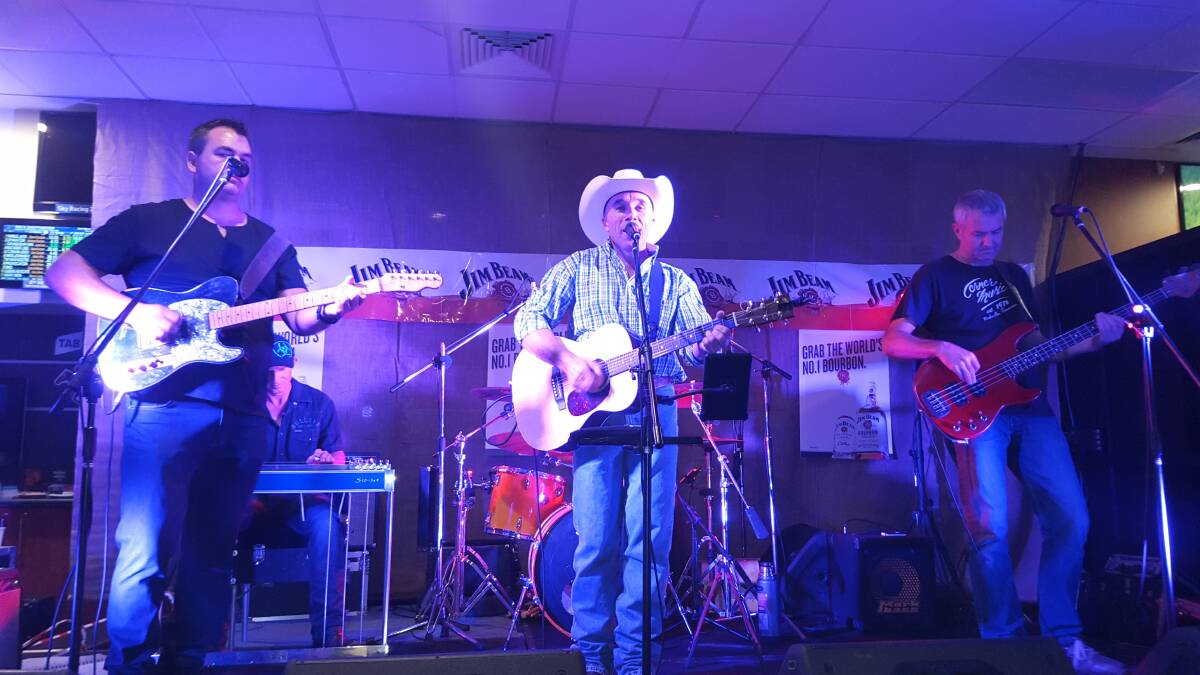 Dan Murphy (centre) performs with Lance Birrell (left) and Gunnedah’s Trevor Stacey (right) at last year's festival. Photo: Mel Birrell