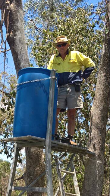 Gunnedah Urban Landcare Group's Mark Kesby with a newly installed Blinky Drinker at Curlewis. Photo: Rod Browne, GULG